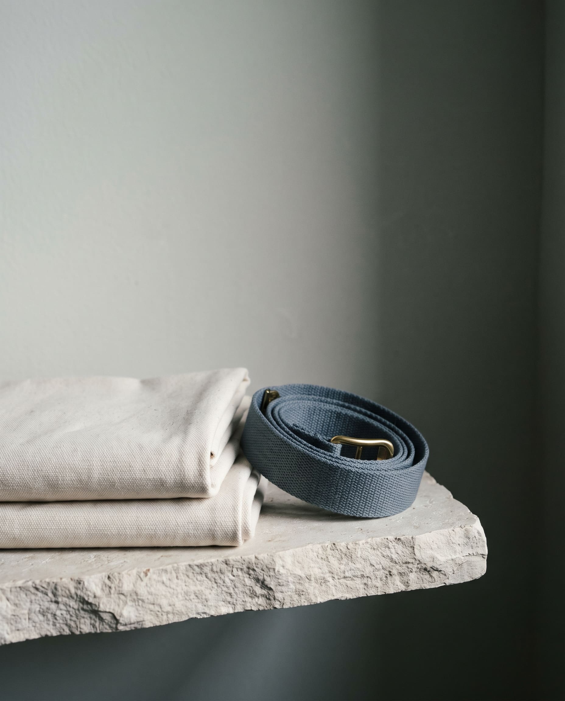 Folded canvas and webbing in diffuse light