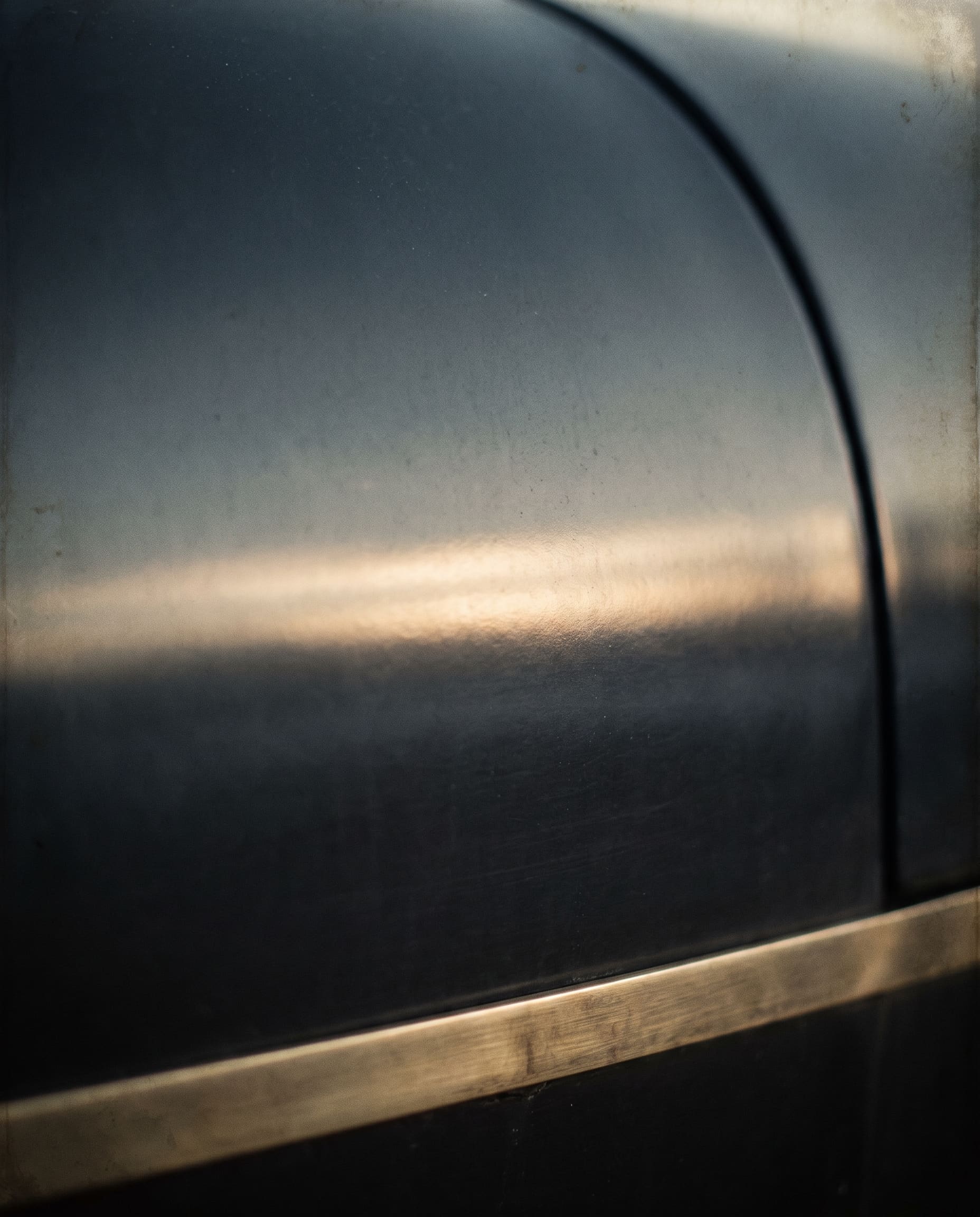 Light across a dark painted surface